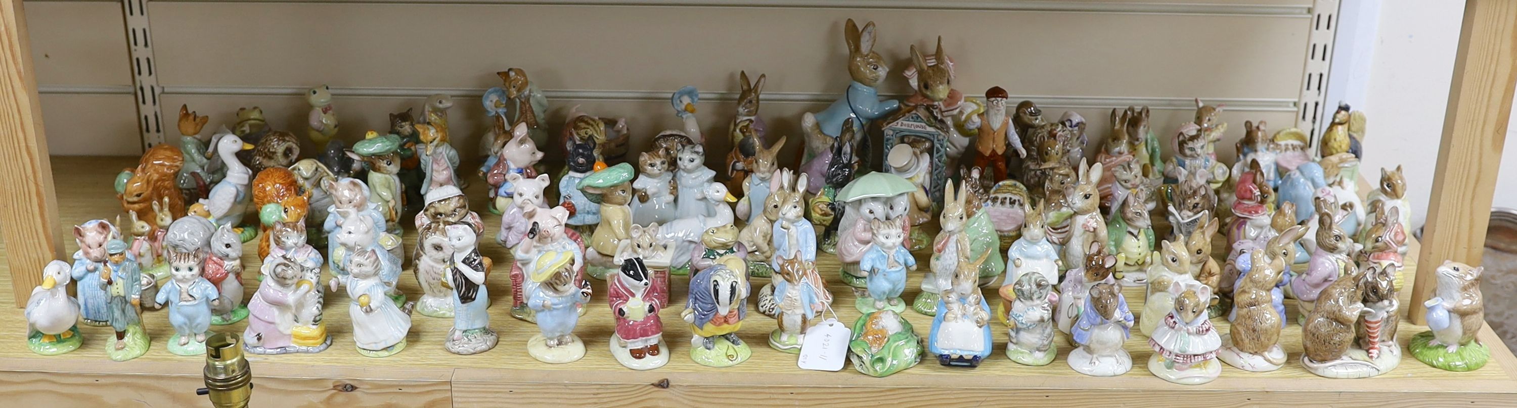 A large collection of Beatrix Potter ceramic figures by Royal Doulton, Beswick and Royal Albert, to include ‘Sir Isaac Newton’ and ‘Mr McGregor’